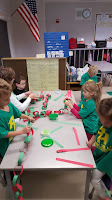 Kids making links for easy inexpensive Christmas STEM craft Teach Magically