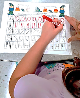 Writing numbers in math centers teach magically